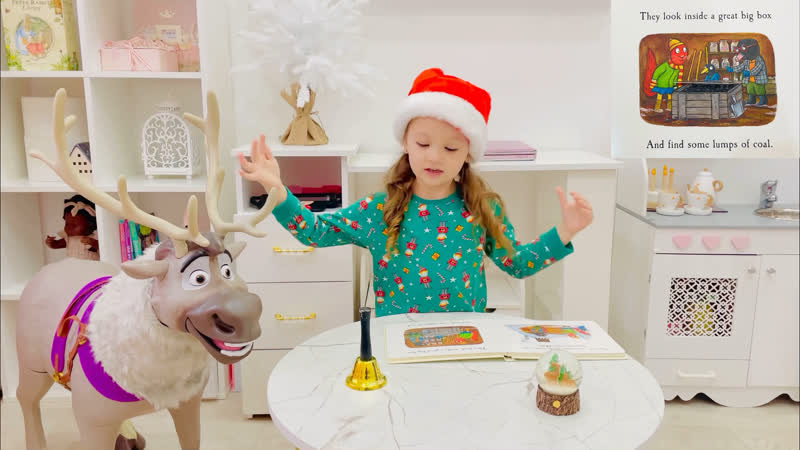 Sophie reads Squirrels Snowman by Julia
